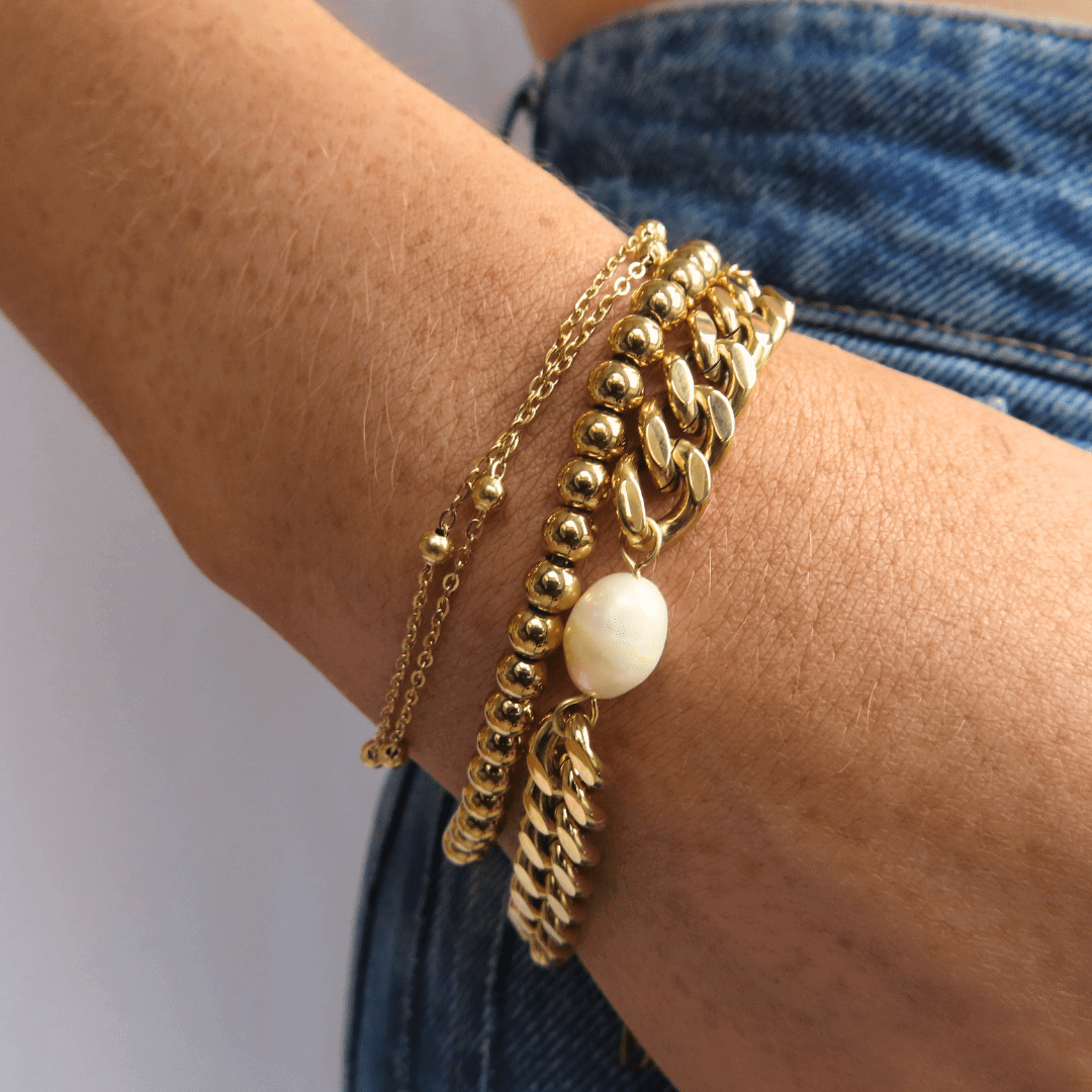 Add some sparkle to your bracelet stack with the Katie Bracelet! ✨ Featuring gold bead details, it’s perfect for mixing and matching with Ash and Ash. Crafted from 18K gold plated stainless steel, it’s water-resistant, tarnish-free, and nickel-free. P.S.