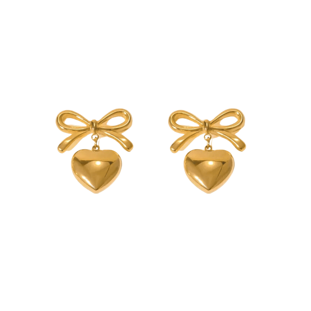 Featuring a gorgeous bow and heart design, the Sian Earrings are your new must-have accessory! 🎀❤️ Crafted from 18K gold plated stainless steel, they’re water-resistant, tarnish-free, and nickel-free. P.S. If you’re gifting them, don’t forget to add a gi