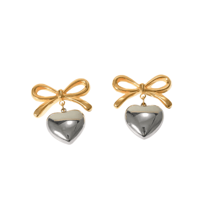 Featuring a gorgeous bow and heart design, the Sian Earrings are your new must-have accessory! 🎀❤️ Crafted from 18K gold plated stainless steel, they’re water-resistant, tarnish-free, and nickel-free. P.S. If you’re gifting them, don’t forget to add a gi