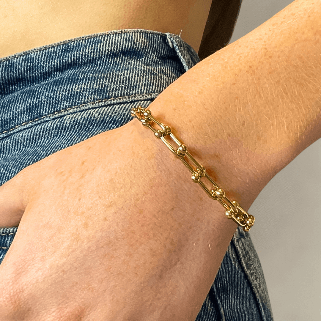 Elevate your wrist game with the Mia Bracelet! ✨ Crafted from 18K gold plated stainless steel, it’s water-resistant, tarnish-free, and nickel-free—ideal for adding a touch of shine to any look. P.S. If you’re gifting it, don’t forget to add a gift box to